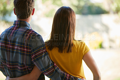 Buy stock photo Rearview shot of a couple looking at the open space in their yard
