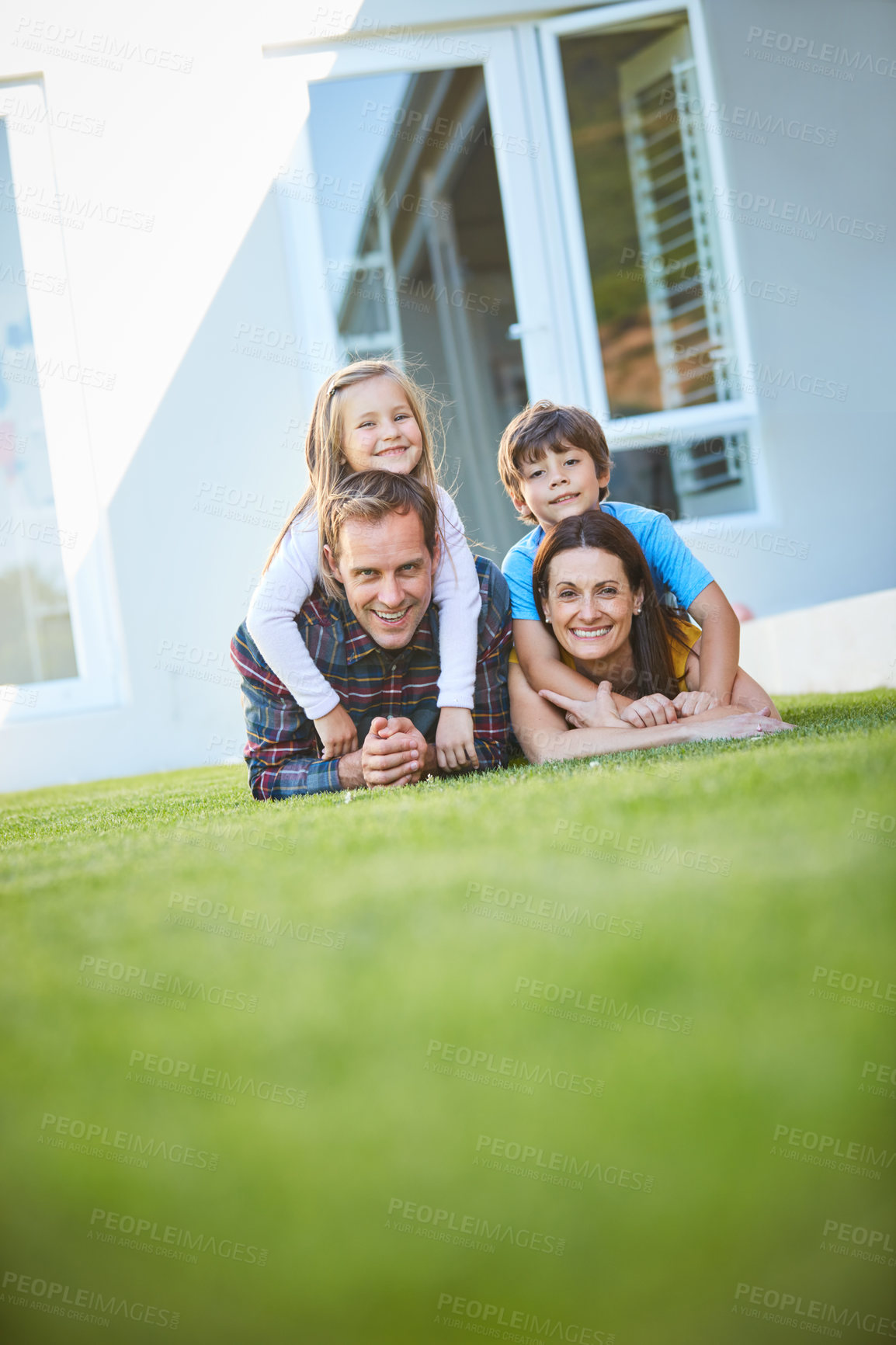 Buy stock photo Happy, grass and portrait of parents and children for bonding, love and relationship. New house, family and mother, father and kids in backyard for playing, childhood and relax together on weekend