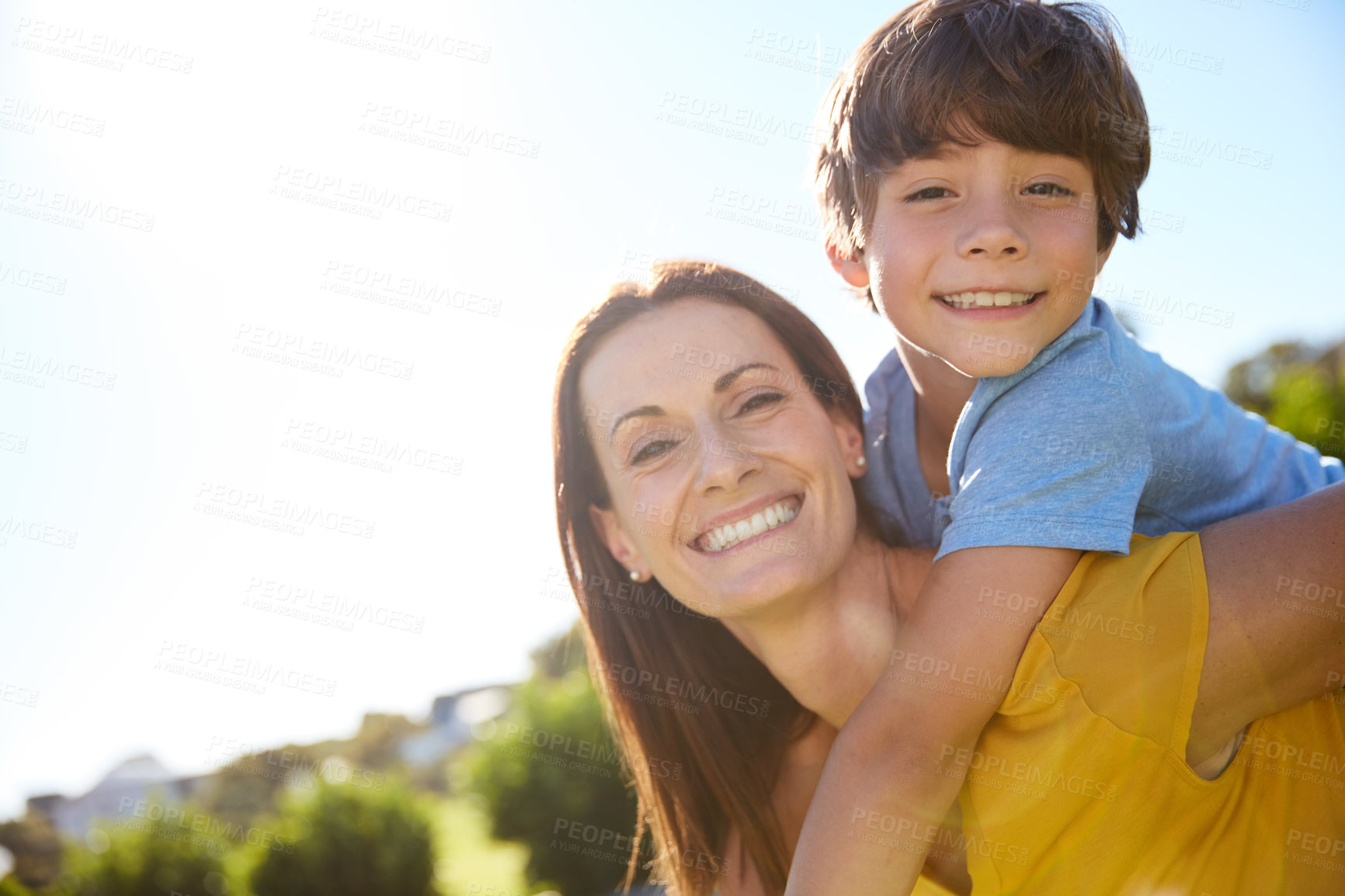 Buy stock photo Smile, piggyback and portrait of mother and son outdoor for bonding, support and connection. Love, happiness and relax with man and child in backyard of family home for care, playful and space