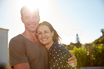 Buy stock photo Cropped shot of an affectionate couple standing outside