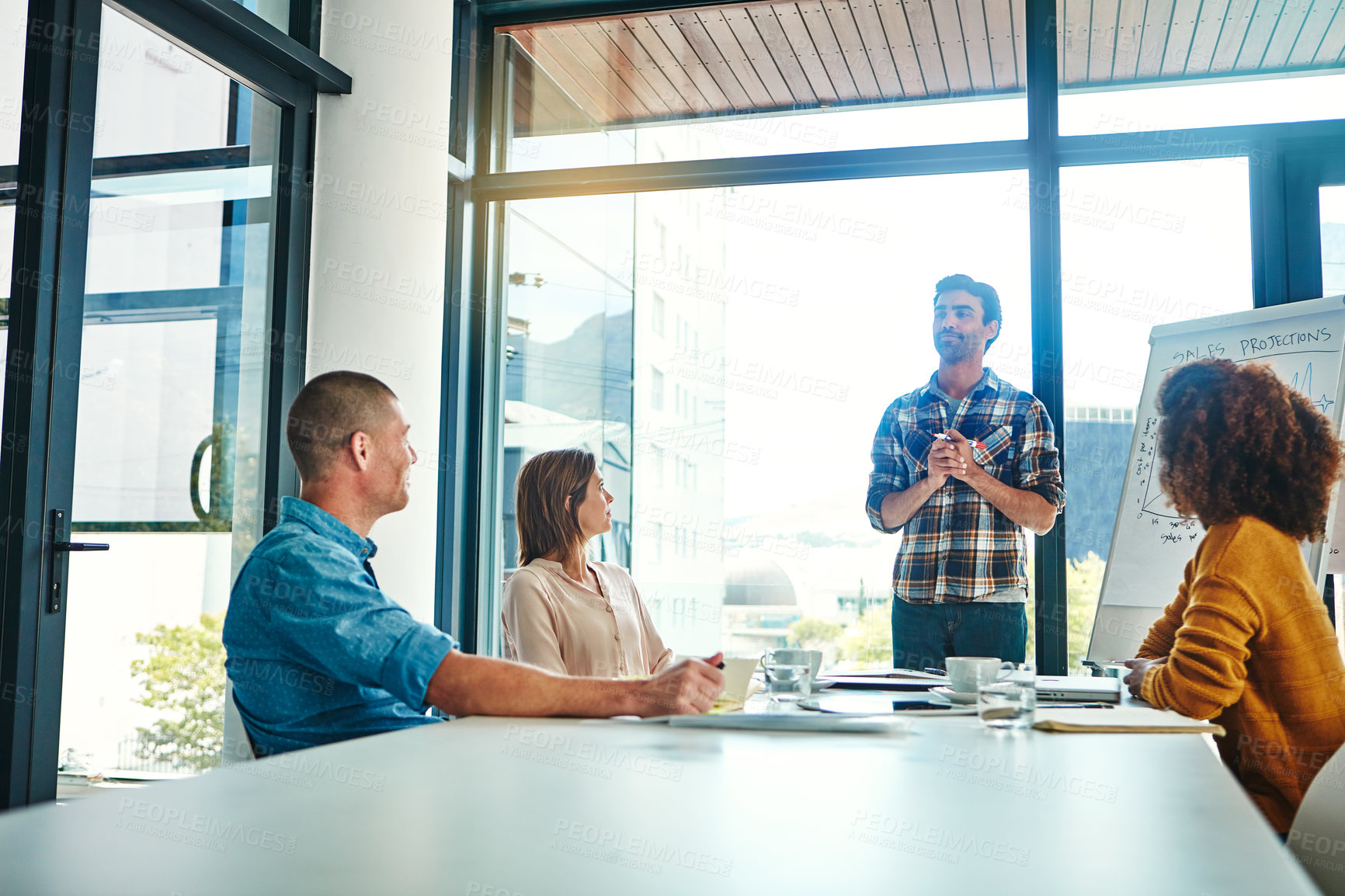 Buy stock photo Cropped shot of a young businessman giving a presentation in the boardroom