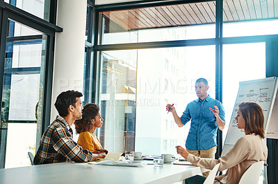 Buy stock photo Cropped shot of a young businessman giving a presentation in the boardroom