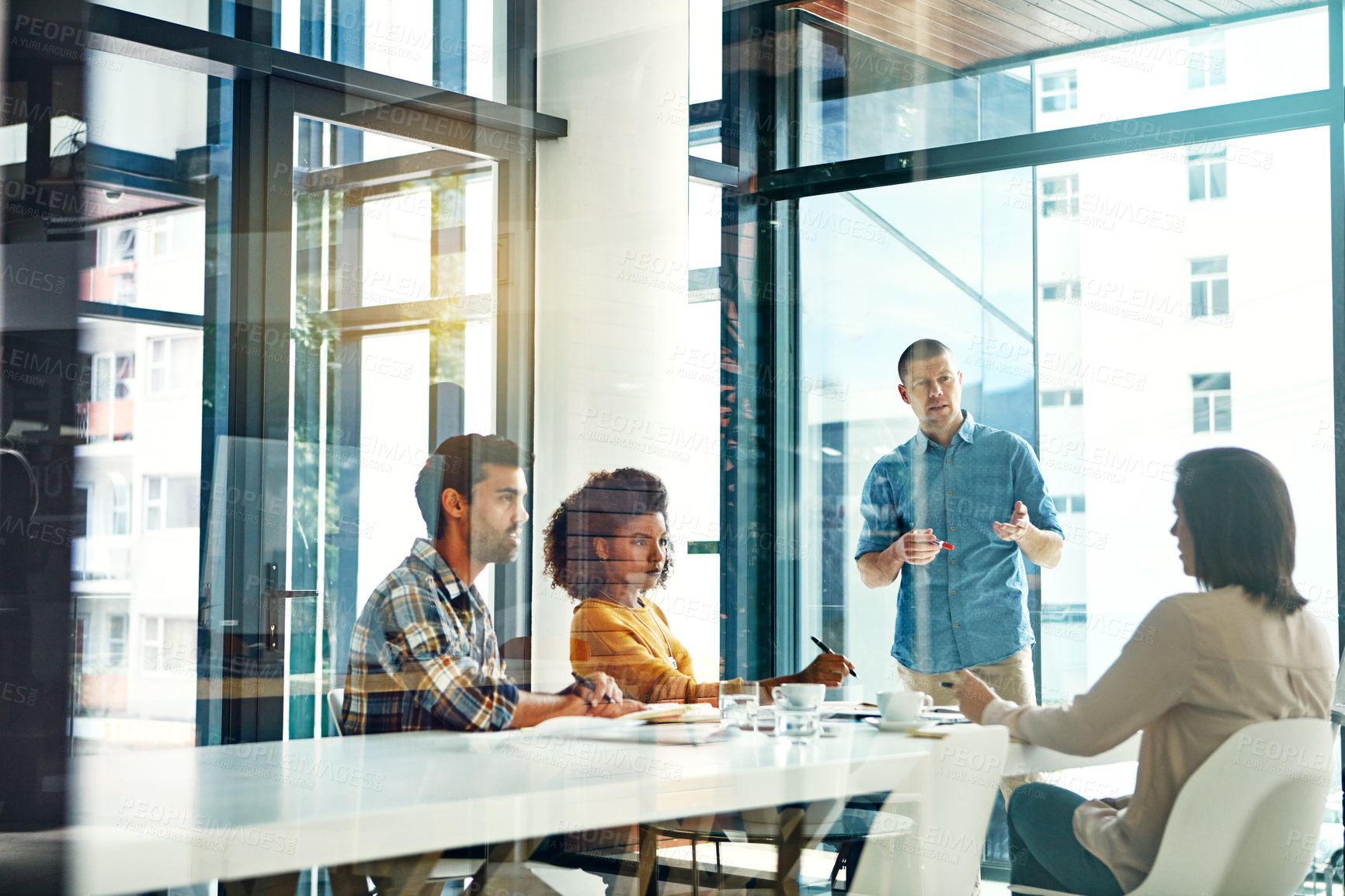 Buy stock photo Cropped shot of a young businessman giving a presentation in the boardroom