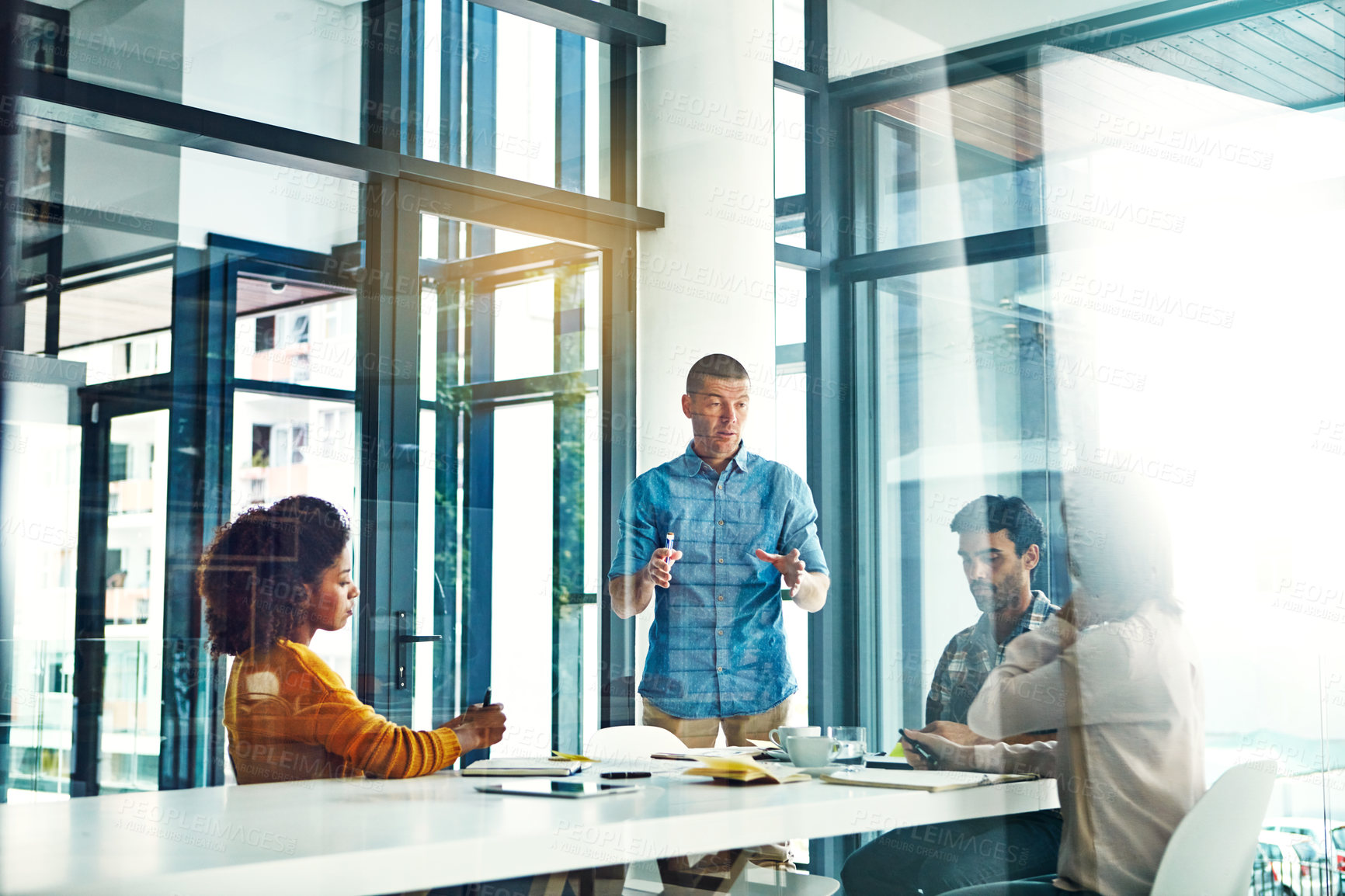 Buy stock photo Cropped shot of a young businessman giving a presentation in the boardroom