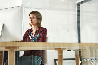 Buy stock photo Cropped shot of a young female designer working at her desk in the office