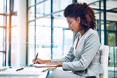 Buy stock photo Cropped shot of a corporate businesswoman working in an office