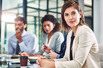 Buy stock photo Portrait of a group of colleagues having a meeting in a modern office