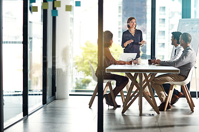 Buy stock photo Presentation, meeting and business people in office building for planning, marketing strategy and goals. Leadership, teamwork and woman speaking to workers for our vision, target and ideas at desk