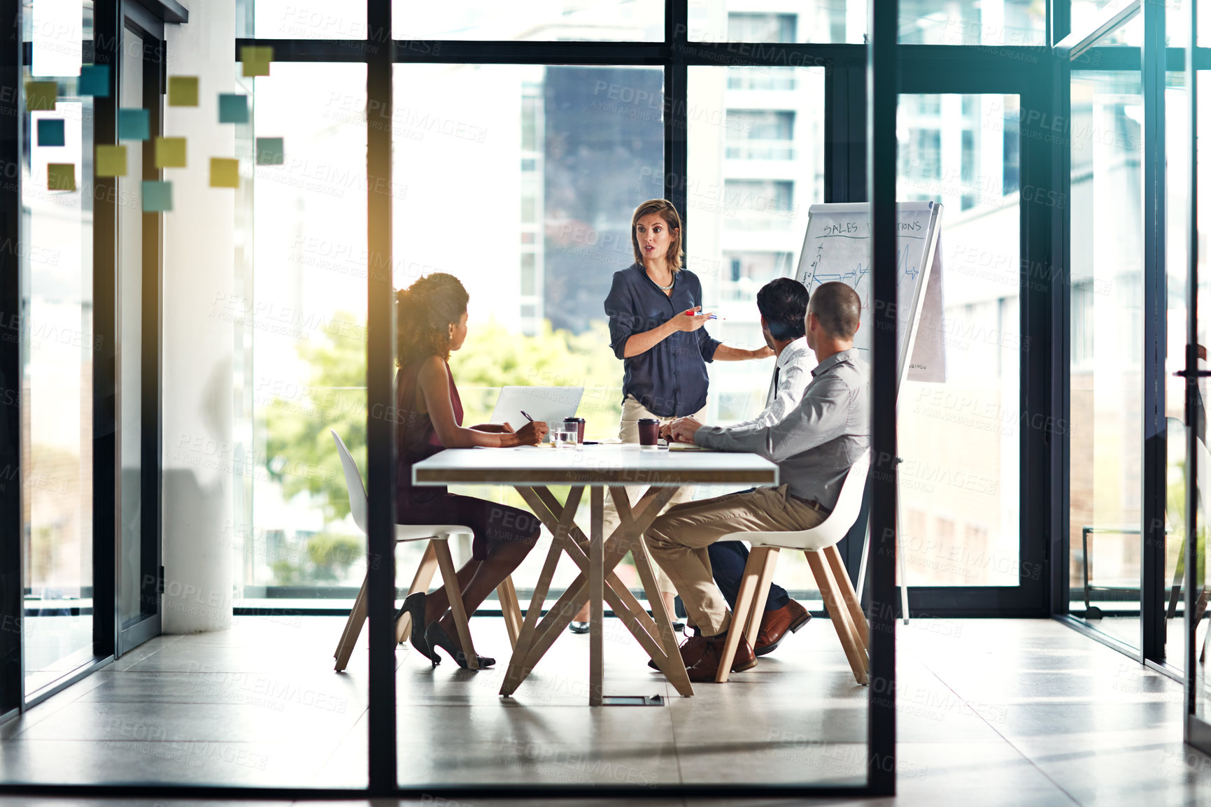 Buy stock photo Shot of a group of colleagues having a meeting in a modern office