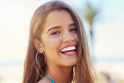 Buy stock photo Portrait of an attractive young woman standing outside on a sunny day