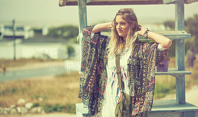 Buy stock photo Shot of a bohemian young woman spending a summer day outside