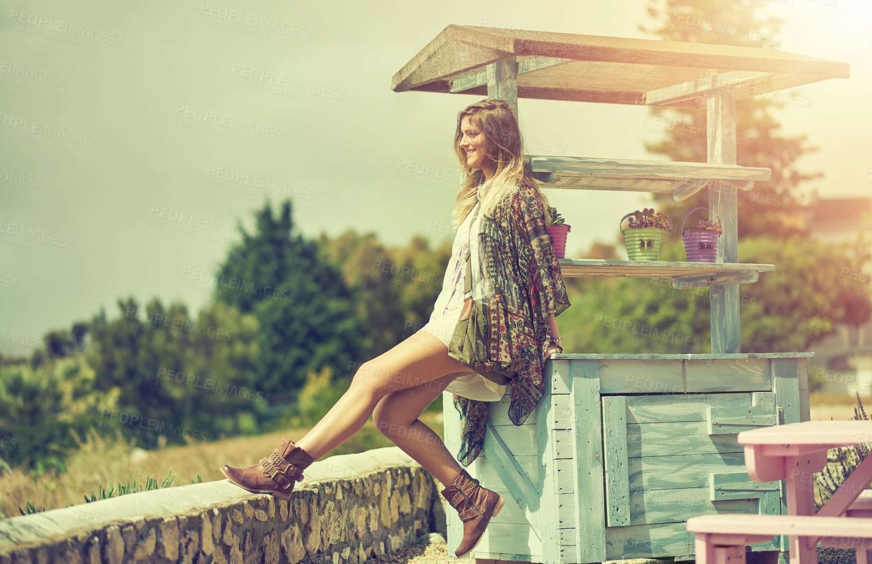 Buy stock photo Cropped shot of an attractive young woman enjoying a day in the summer