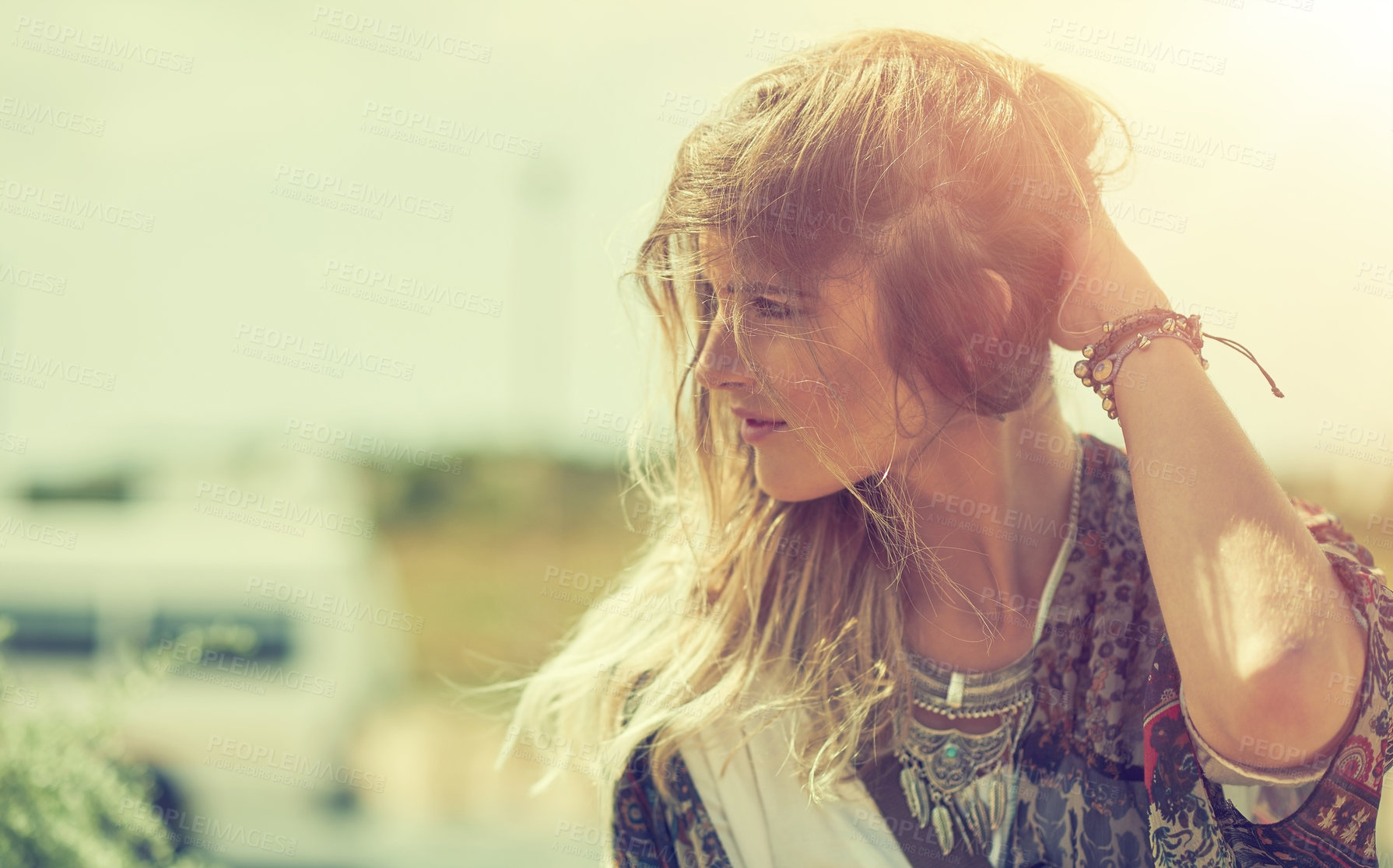 Buy stock photo Shot of a bohemian young woman spending a summer day outside