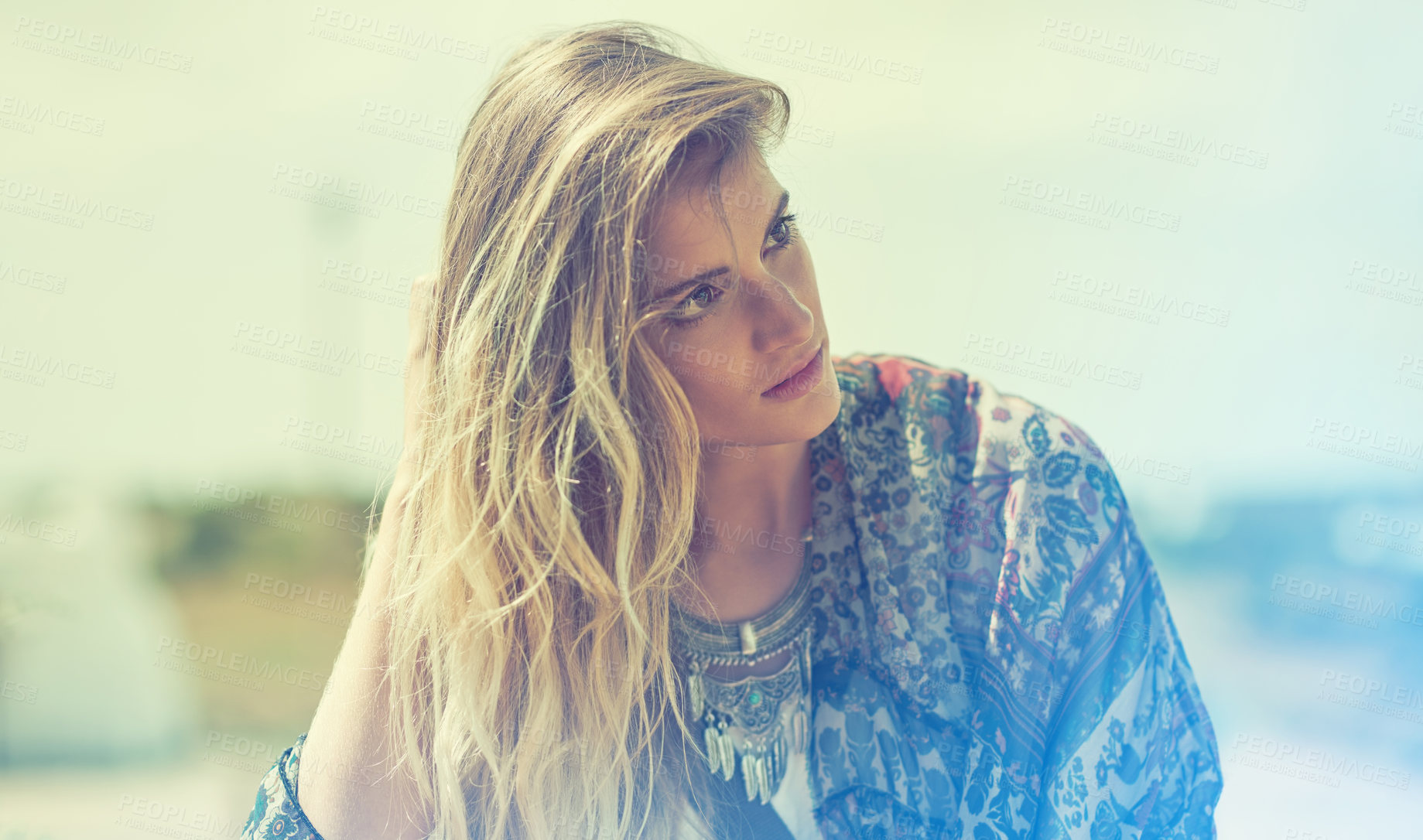 Buy stock photo Shot of a bohemian young woman spending a summer day outside