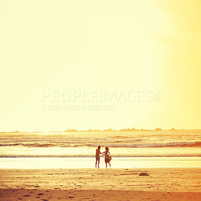 Buy stock photo Shot of an affectionate young couple on the beach