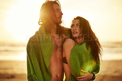 Buy stock photo Cropped shot of an affectionate couple standing on the beach