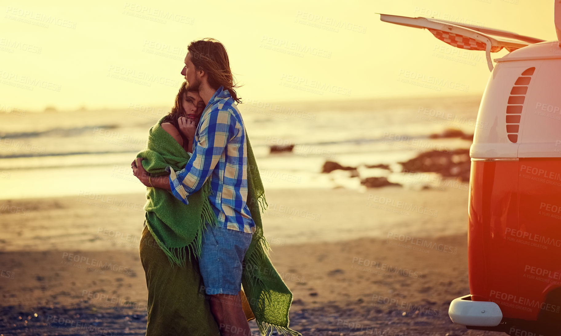 Buy stock photo Cropped shot of an affectionate couple standing on the beach