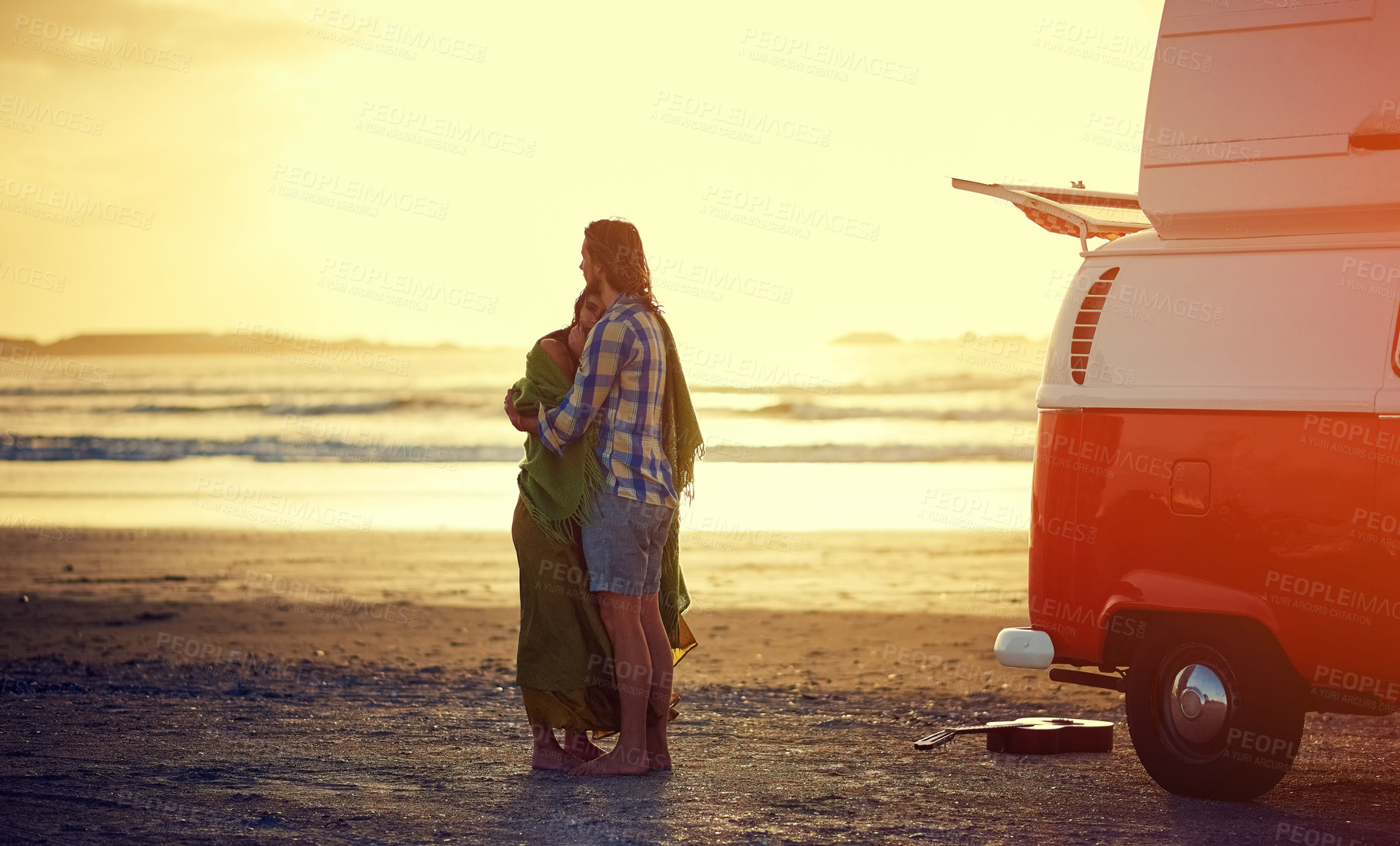 Buy stock photo Shot of an affectionate young couple on the beach