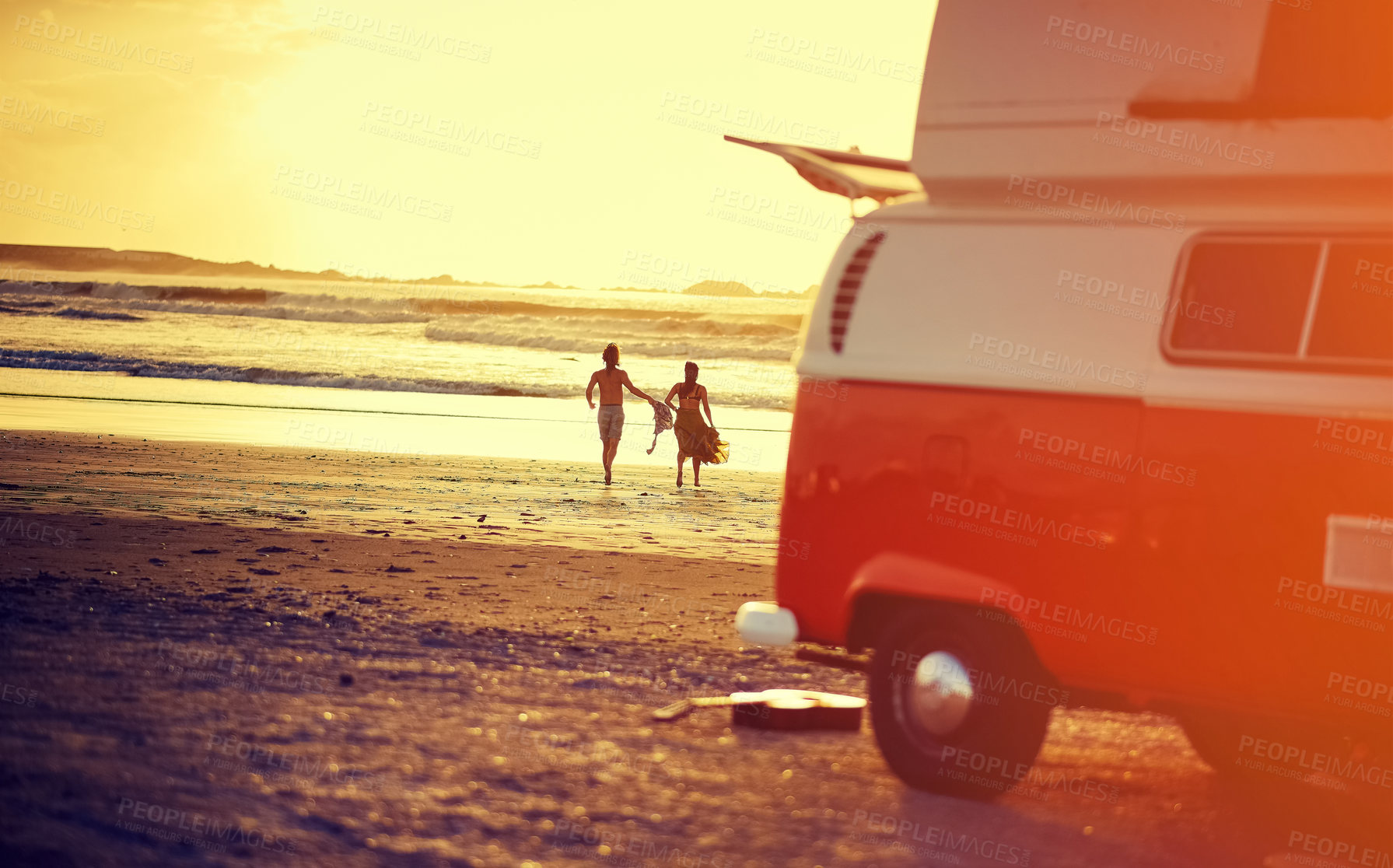 Buy stock photo Back, road trip and van with couple on beach together for holiday, travel or vacation at sunset. Flare, space and view with people outdoor on sand at coast for bonding, connection or weekend
