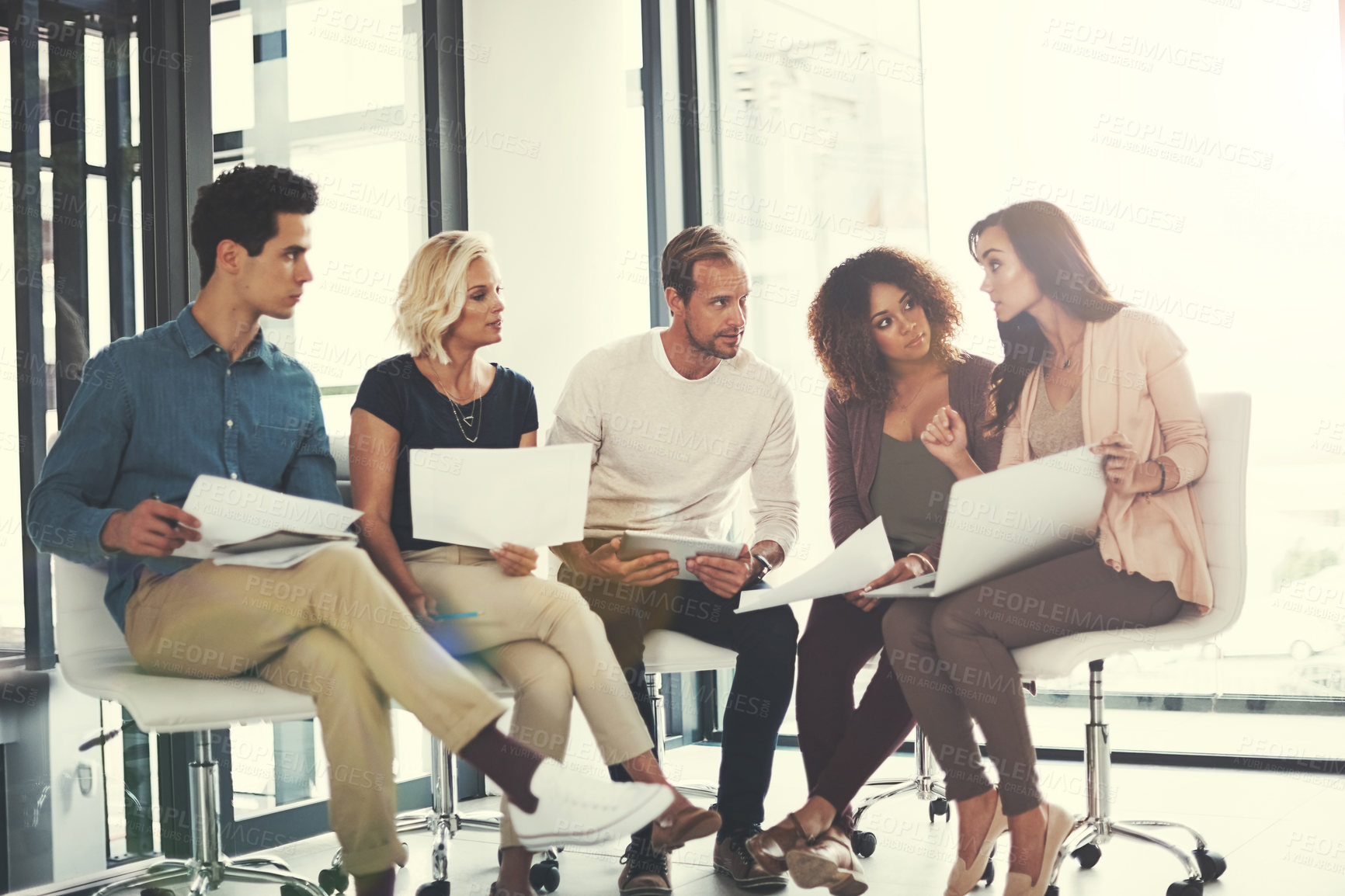 Buy stock photo Shot of a team of designers brainstorming together in an office