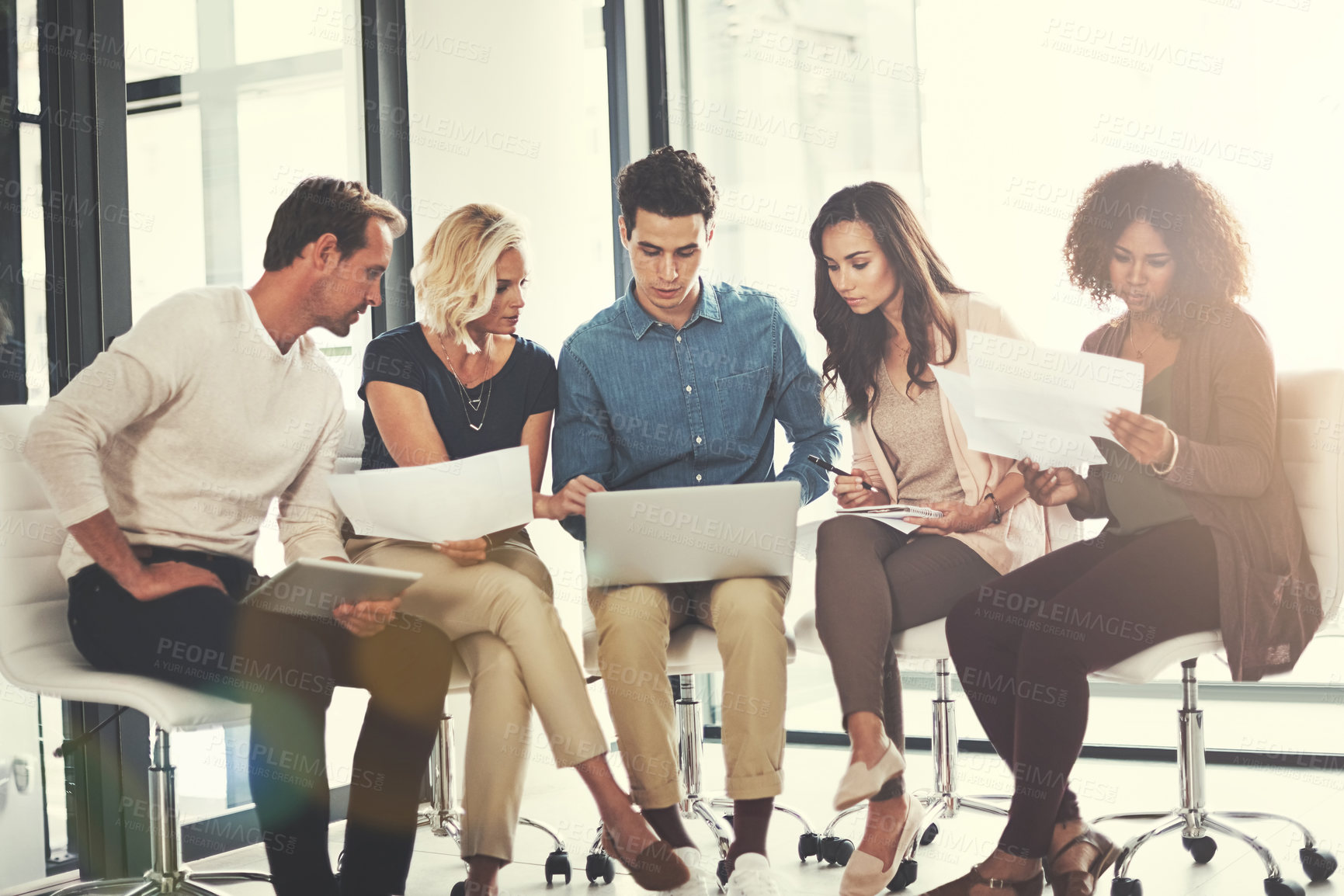 Buy stock photo Shot of a team of designers brainstorming together in an office