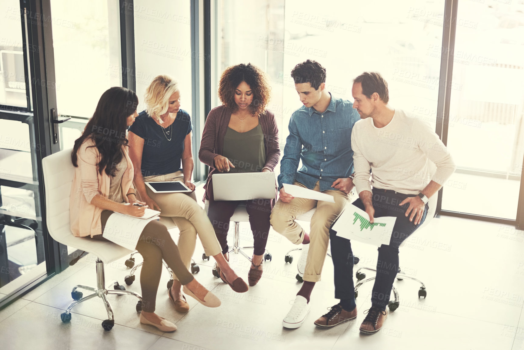 Buy stock photo Shot of a team of designers brainstorming together in an office