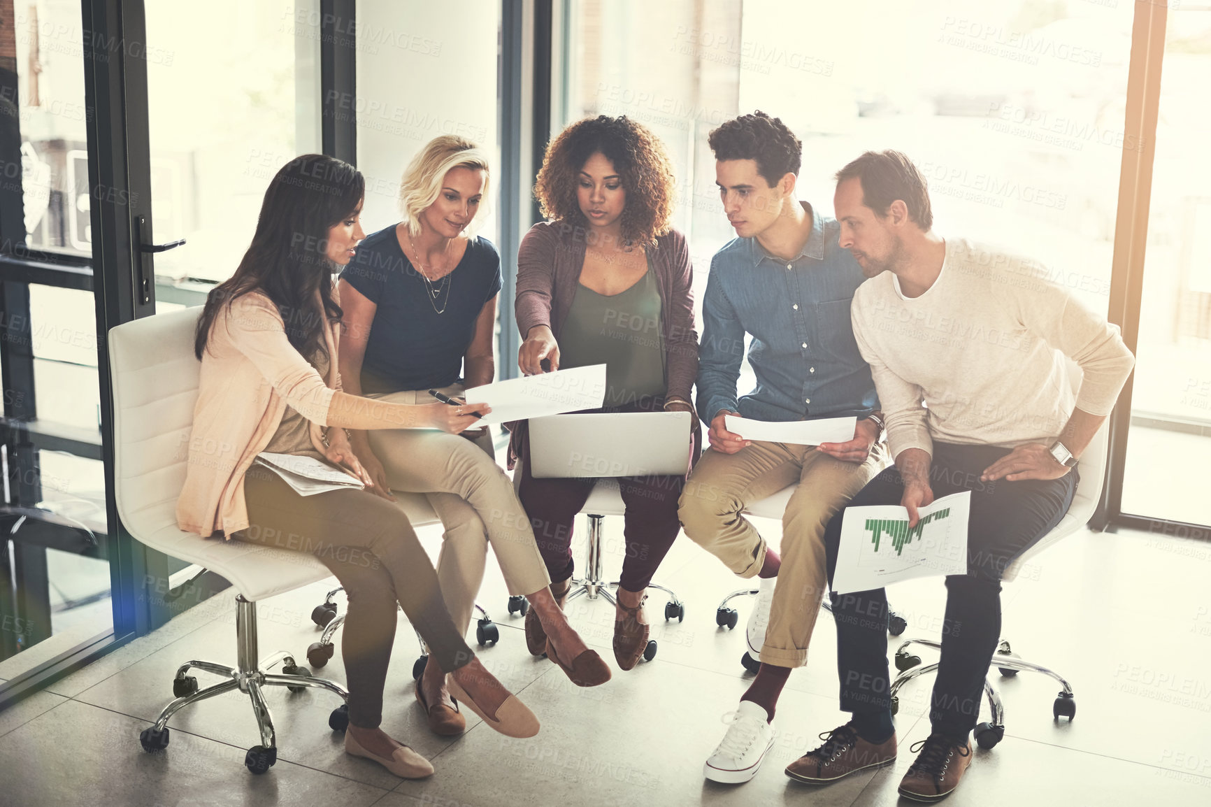 Buy stock photo Shot of a team of designers brainstorming together in an office