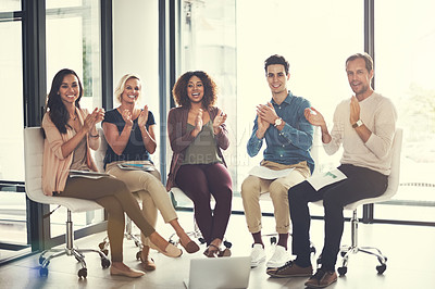 Buy stock photo Portrait of a team of designers applauding together in an office