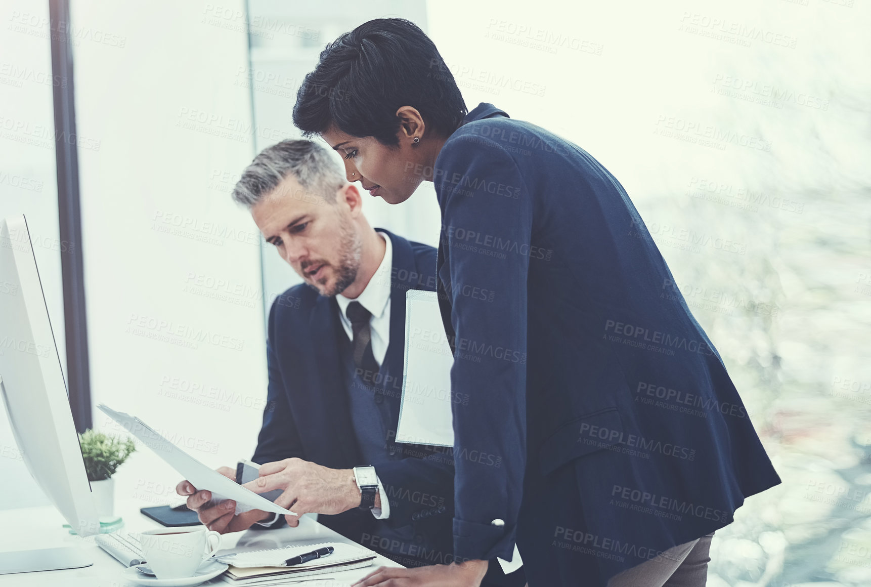 Buy stock photo Shot of a businesswoman and businessman collaborating on a project at work