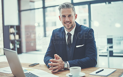 Buy stock photo Portrait of a mature businessman working at his desk in a modern office