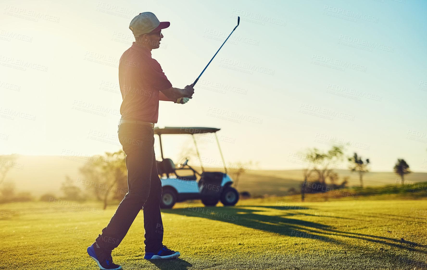 Buy stock photo Shot of a young man playing golf