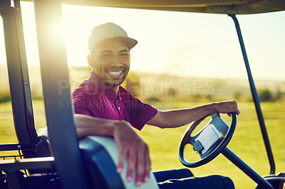 Buy stock photo Portrait of a happy young man driving a cart on a golf course