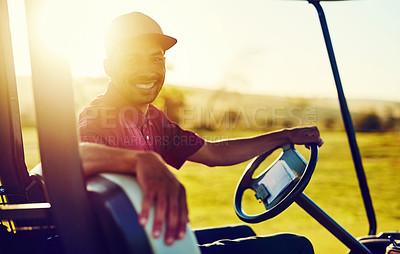 Buy stock photo Portrait of a happy young man driving a cart on a golf course