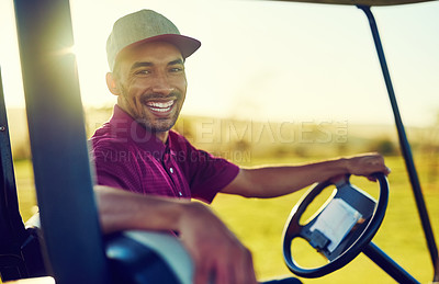 Buy stock photo Portrait of a happy young man driving a cart on a golf course