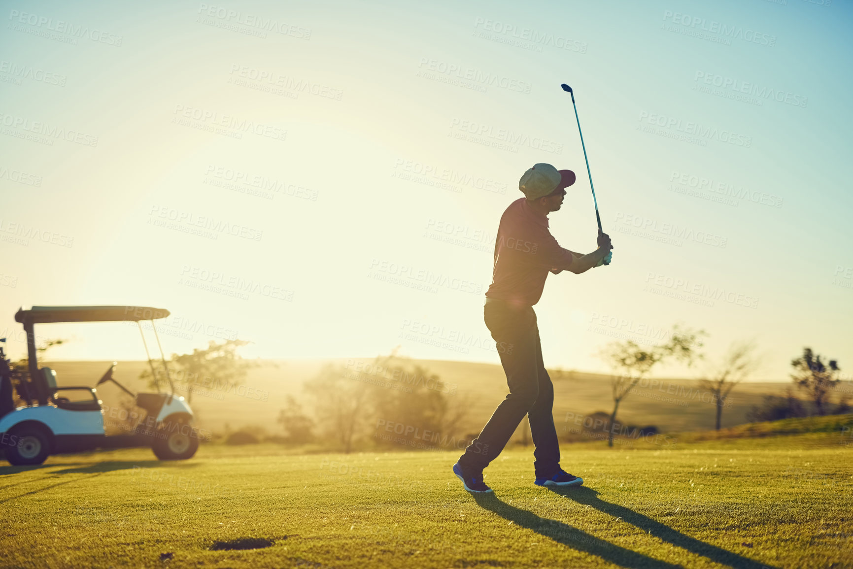 Buy stock photo Shot of a young man playing golf