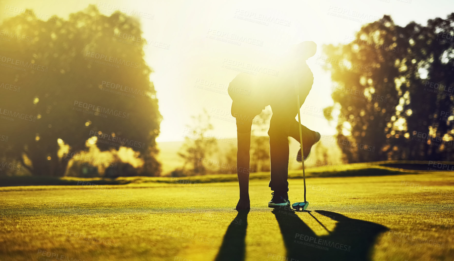 Buy stock photo Shot of a young man playing golf