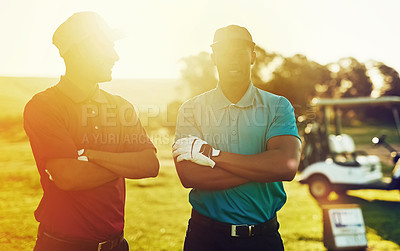 Buy stock photo Shot of two friends standing together on a golf course