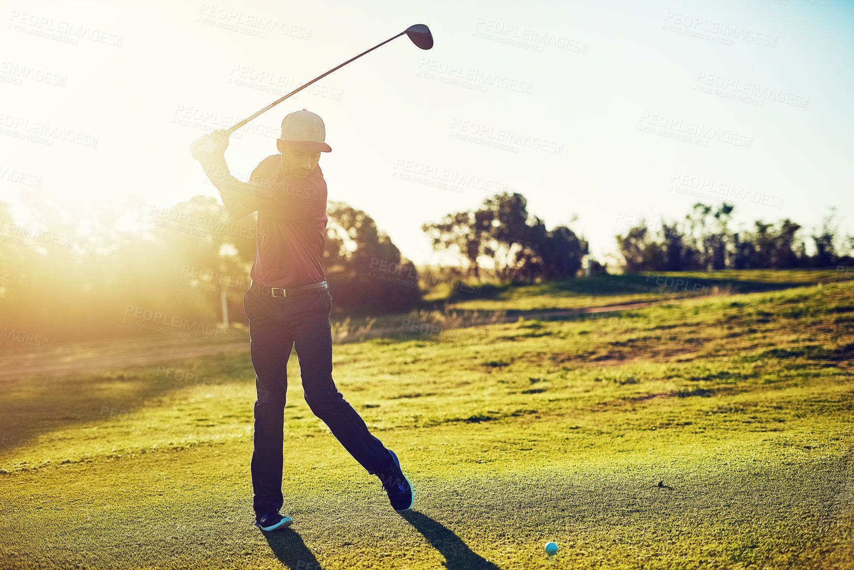 Buy stock photo Shot of a young man playing golf