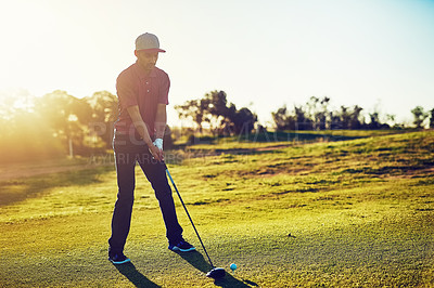 Buy stock photo Shot of a young man playing golf