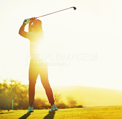 Buy stock photo Shot of a young man playing golf