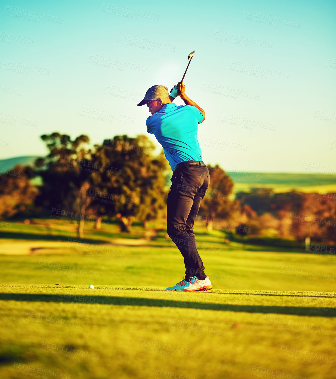 Buy stock photo Shot of a young man playing golf