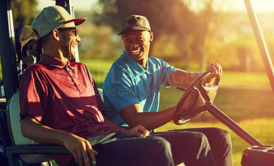 Buy stock photo Shot of two men sitting in a cart on a golf course