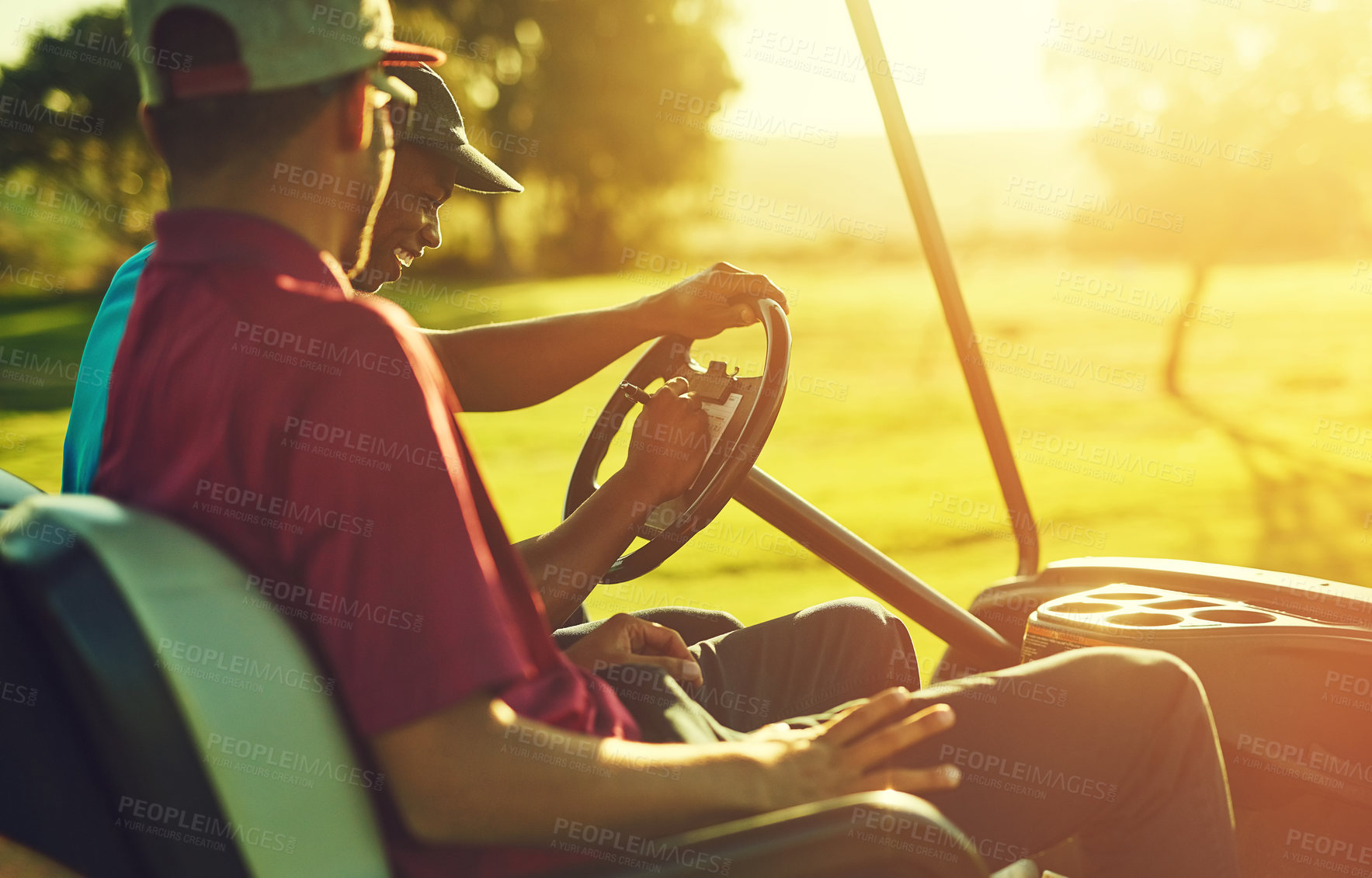 Buy stock photo Shot of two men sitting in a cart on a golf course