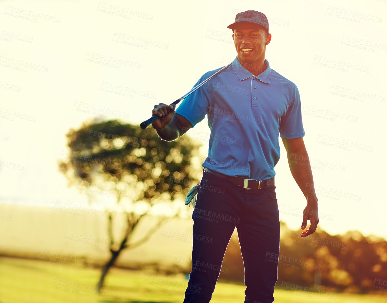 Buy stock photo Shot of a young man playing golf