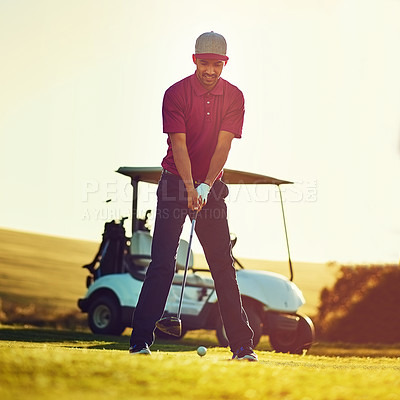 Buy stock photo Shot of a young man playing golf