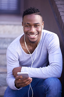 Buy stock photo Black man, portrait and cellphone with earphones on stairs in city or music subscription, travel or relax. Male person, face and smartphone on downtown street in Atlanta or podcast, playlist or track