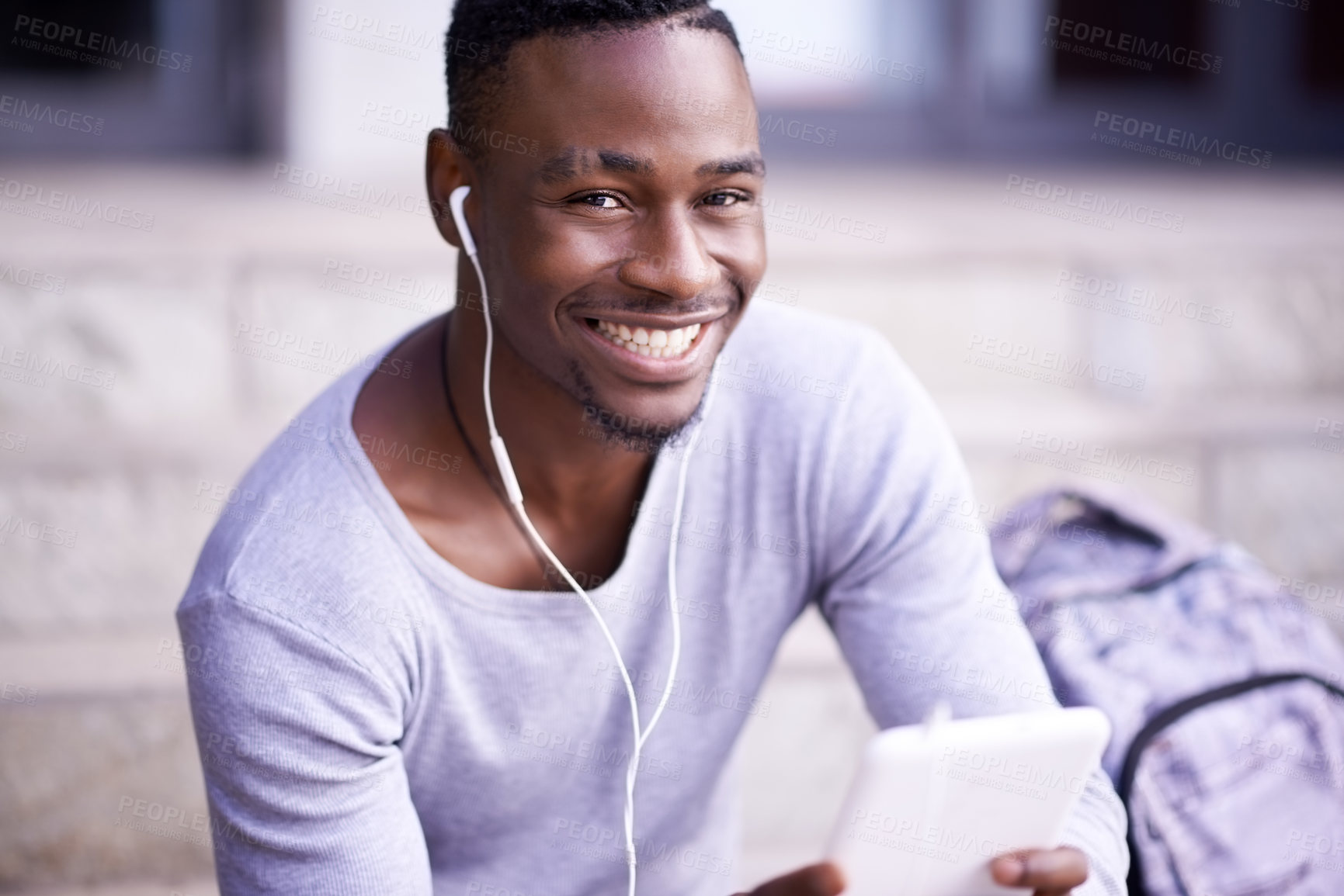 Buy stock photo Student, black man and portrait in city with tablet for information on university schedule or classes. Pupil, digital tech and internet with music on college steps, happy and online academic journal.