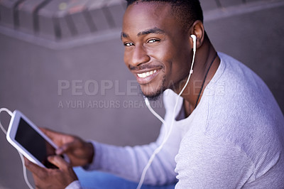 Buy stock photo Tablet, music and portrait of happy black man online for streaming audio, sound or social media  app outdoor. Face, smile and earphones for listening to radio, tech and scroll on website in Kenya