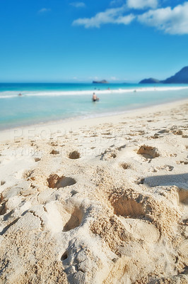 Buy stock photo Holiday, blue sky and beach with footprints in sand, clouds and tropical adventure for travel getaway in nature. Summer, water and ocean waves with natural coastline for island vacation in Australia