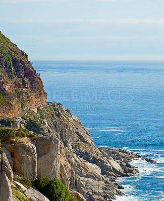 Buy stock photo Mountain, road and sea with rocks, water and destination for travel getaway by ocean in nature. Island tourism, highway and beach with scenic paradise, holiday and vacation adventure in Indonesia